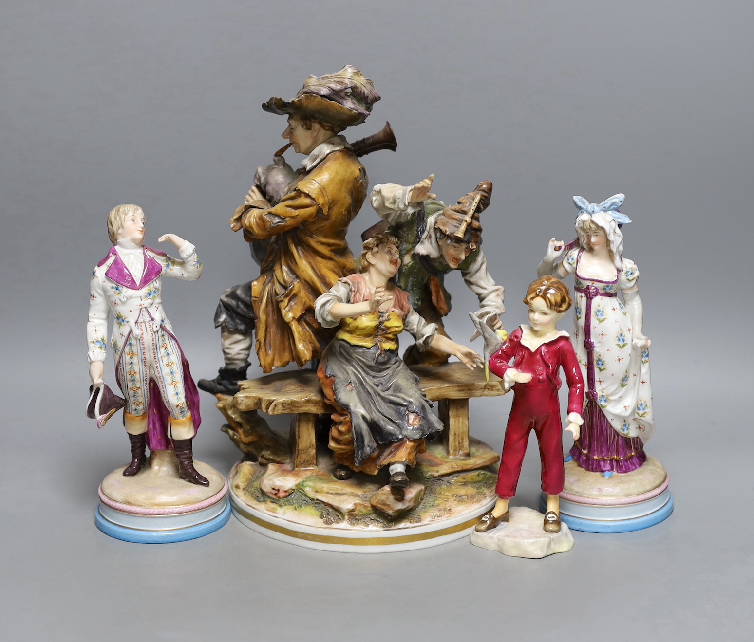 A pair of KPM style porcelain figures of a maiden and a gallant, 22cm, a Capo di Monte figure group, 29cm, and a Royal Worcester figure 'The Parakeet', modelled by F.G. Doughty, no.3087